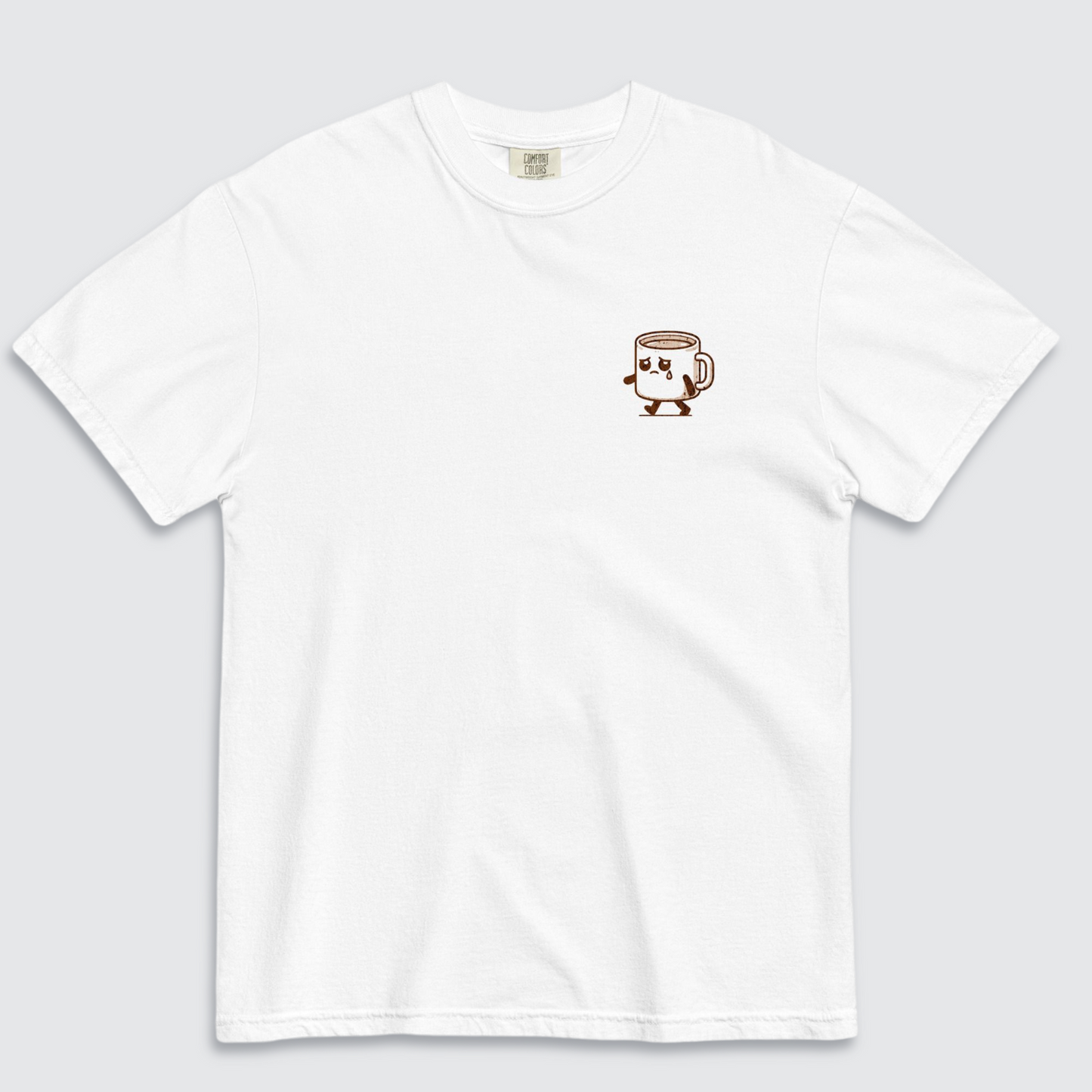 White tshirt with a graphic of a sad espresso cup with 'sad espresso' on the left chest