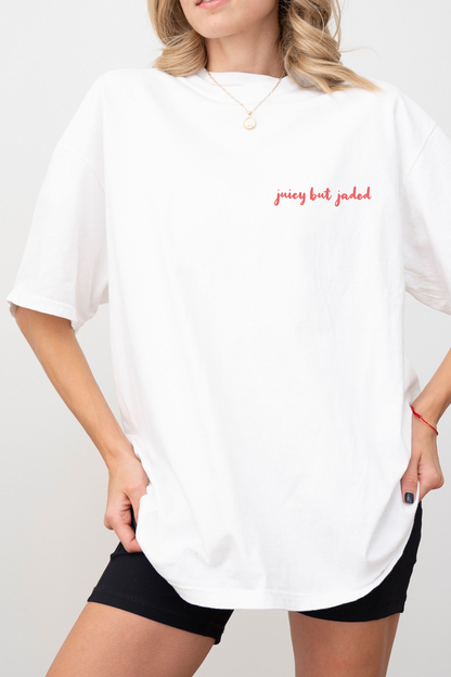 Front of model wearing white tshirt with saying 'juicy but jaded'