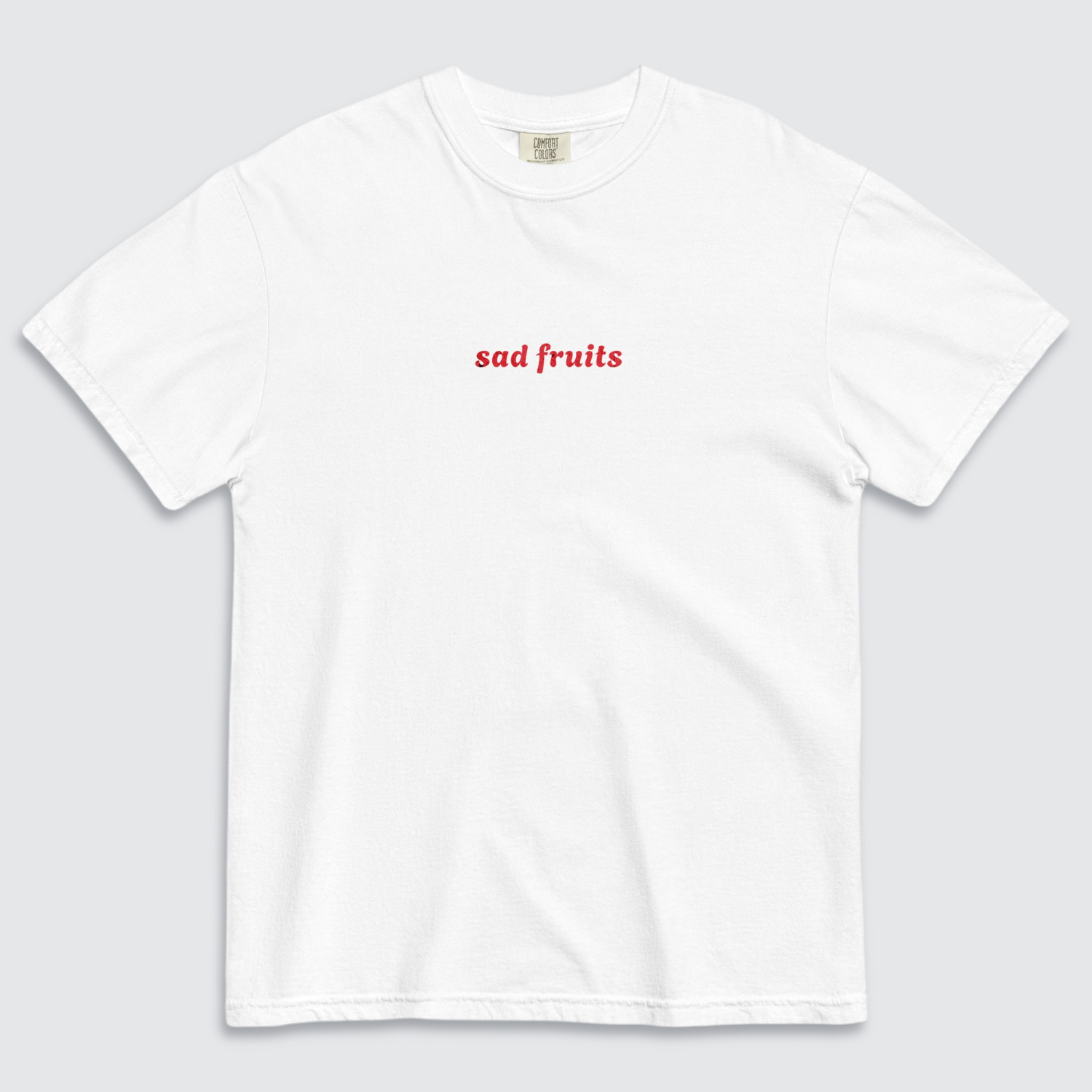 White tshirt with 'sad fruits' written in red text across the chest