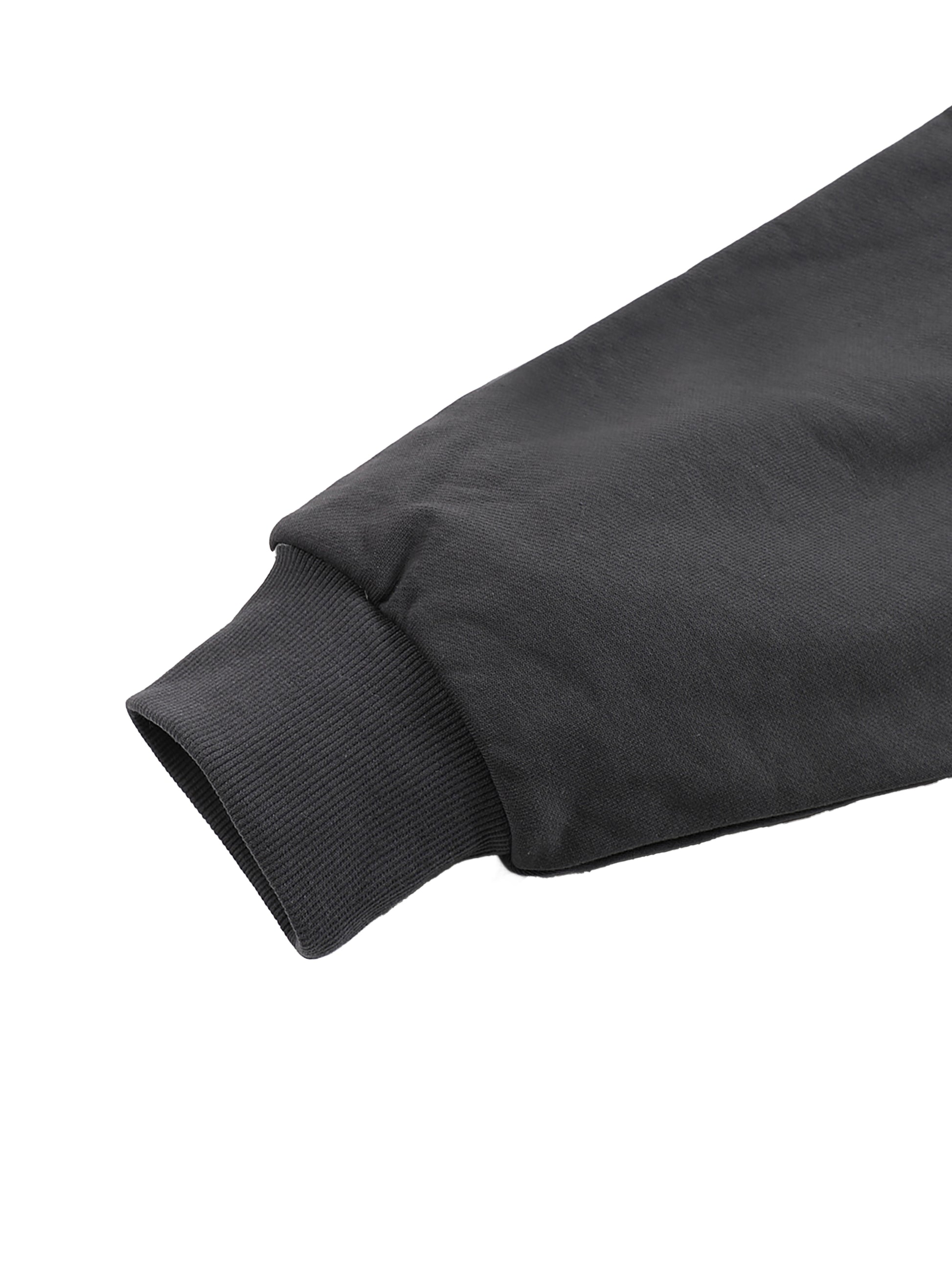 Close-up of a black sleeve on a white background